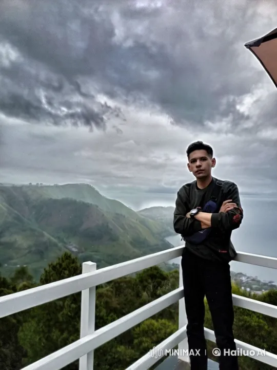 Young Man on Terrace Reflects in Animated Live2D Landscape – AI Generated Video | Hailuo AI