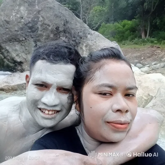 Two Individuals Enjoying Nature's Calm by a Rock – AI Generated Video | Hailuo AI