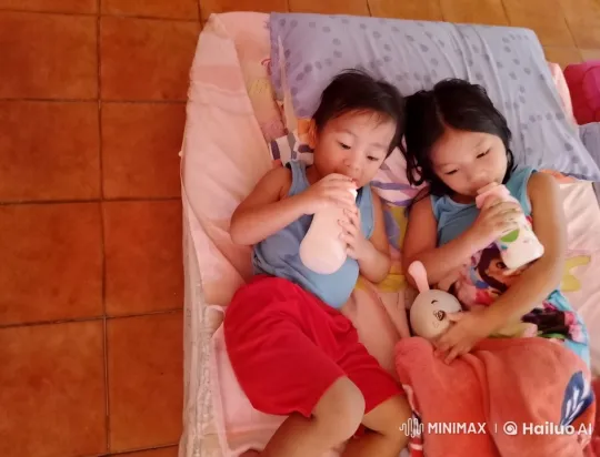 Two Children Playfully Interact on Mattress – AI Generated Video | Hailuo AI