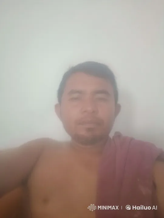 Man with Towel on Shoulder in Minimalistic Setting – AI Generated Video | Hailuo AI