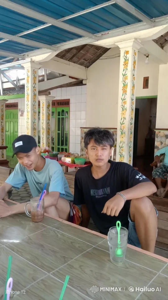 Young Men Engage in Playful Kungfu Sparring at Cozy Establishment – AI Generated Video | Hailuo AI