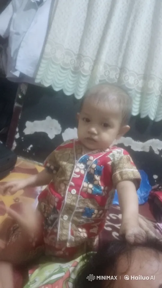 Child on Bed Playing with Adult's Hair – AI Generated Video | Hailuo AI