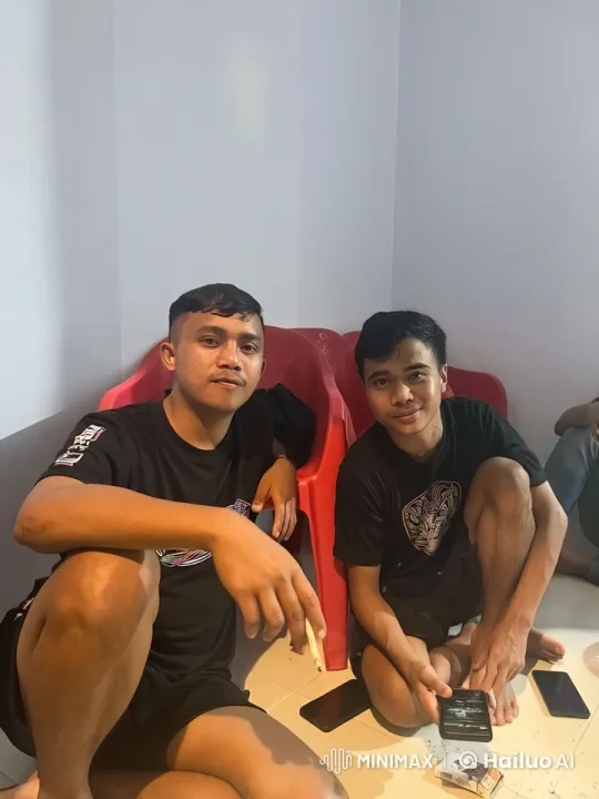 Two Young Men Relaxing in a Plain Room – AI Generated Video | Hailuo AI