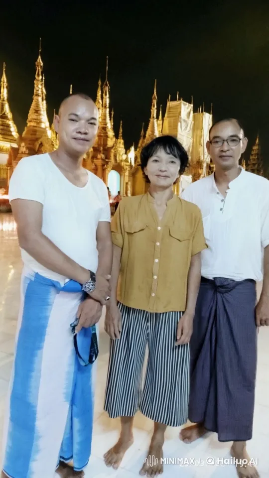 Traditional Attire Poses in Front of Glowing Temple – AI Generated Video | Hailuo AI