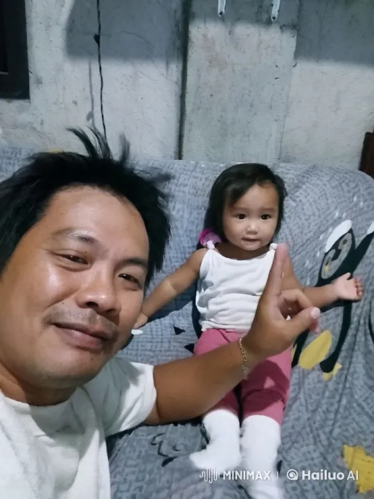 Child and Adult Bonding on Patterned Couch – AI Generated Video | Hailuo AI