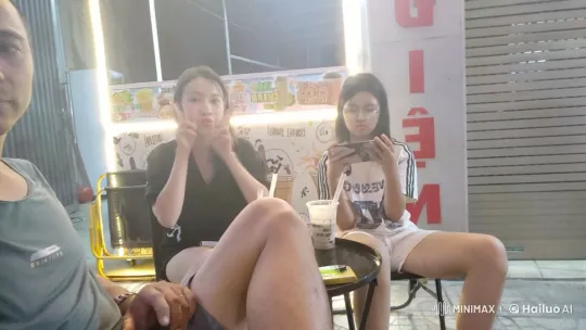 Friends Engage in Playful Fight Outside Cafe – AI Generated Video | Hailuo AI