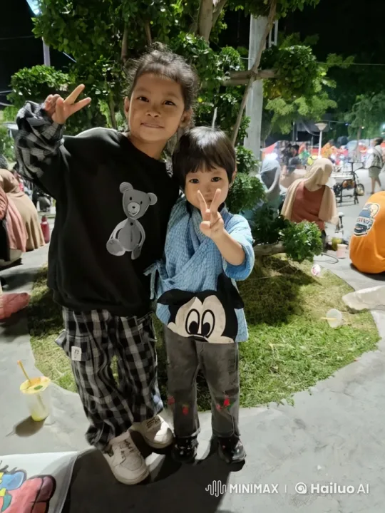 Children Perform Playful Martial Arts in Crowded Night Setting – AI Generated Video | Hailuo AI