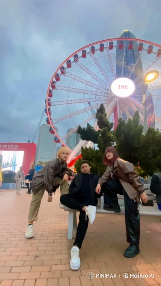 Dynamic Kungfu Trio Performs in Front of Moving Ferris Wheel – AI Generated Video | Hailuo AI