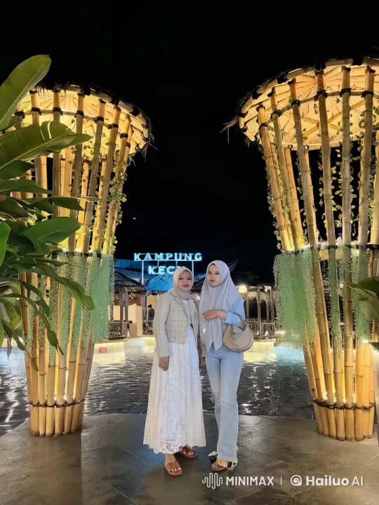 Night at Kampung Kecil: Women Amidst Bamboo and Lights – AI Generated Video | Hailuo AI