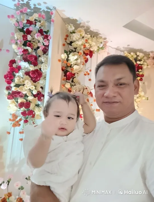 Man and Child's Loving Exchange in Floral Setting – AI Generated Video | Hailuo AI