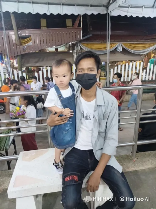 Young Man and Toddler Enjoying Bustling Public Space – AI Generated Video | Hailuo AI