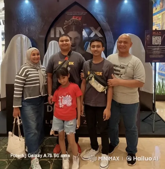 Family Dances Cheerfully in Front of IMAX Poster – AI Generated Video | Hailuo AI