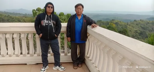 Two Men Overlooking Scenic Hills on Balcony – AI Generated Video | Hailuo AI