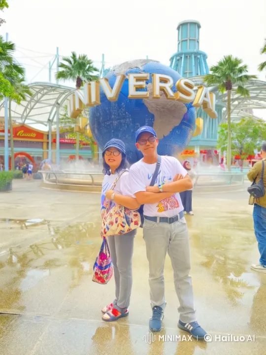 Playful Fight in Front of Universal Studios Globe – AI Generated Video | Hailuo AI