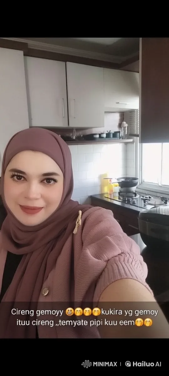 Domestic Humor: Woman in Hijab Takes Selfie in Kitchen – AI Generated Video | Hailuo AI
