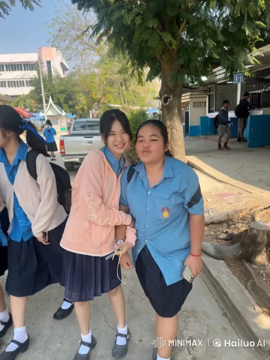 Two Students Share a Joyful Moment in a Schoolyard – AI Generated Video | Hailuo AI