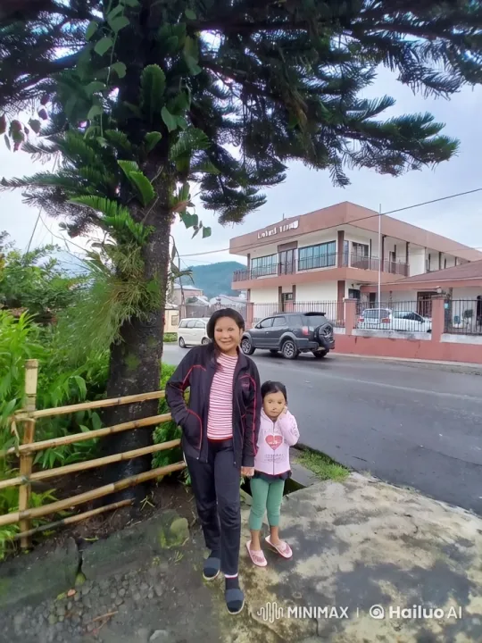Laura and Girl Stand Under Tree, Peaceful Street Scene – AI Generated Video | Hailuo AI