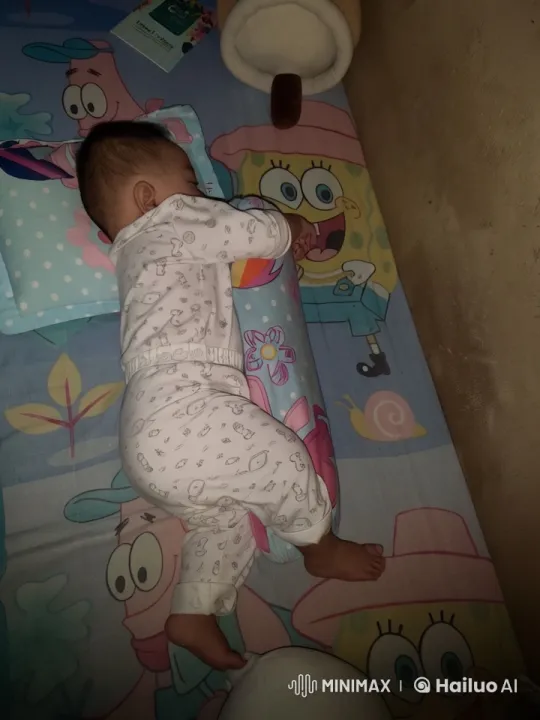 Baby's Peaceful Sleep with Cartoon Bedding and Soft Toys – AI Generated Video | Hailuo AI