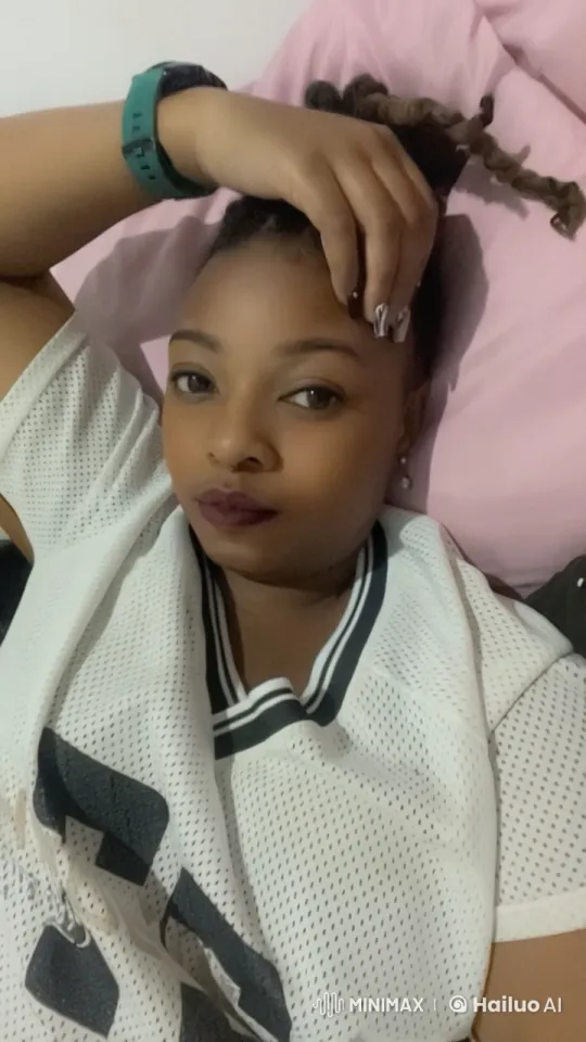 Girl on Bed with Pulsing Eyes and Gentle Smile – AI Generated Video | Hailuo AI