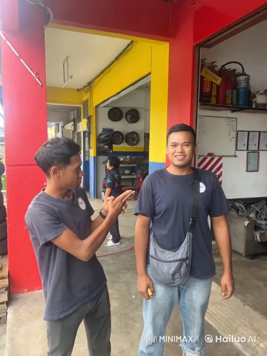 Casual Attire Martial Arts Exchange in Automotive Workshop – AI Generated Video | Hailuo AI