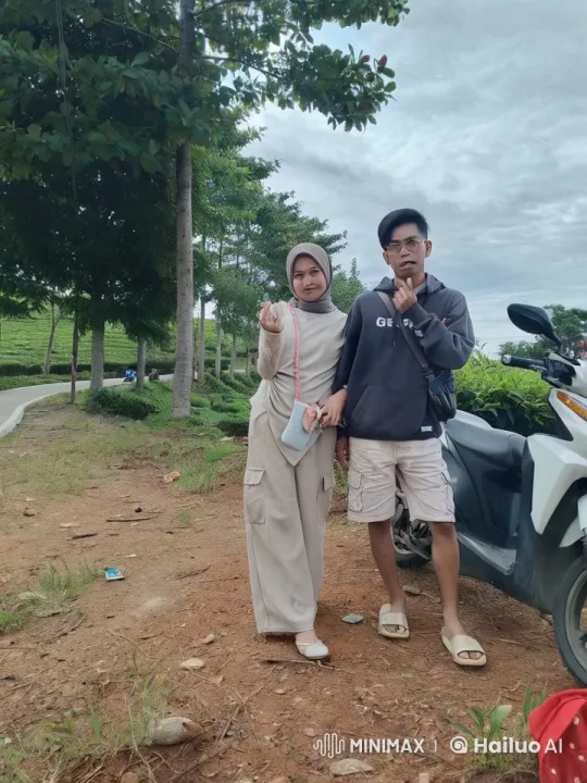 Outdoor Kungfu Display by Hooded Man and Hijab-Wearing Woman – AI Generated Video | Hailuo AI
