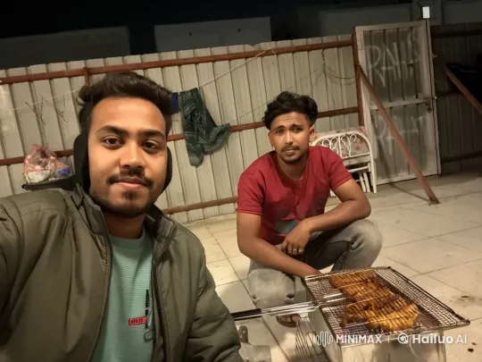 Rooftop Barbecue: Two Men Enjoy Evening Grilling – AI Generated Video | Hailuo AI
