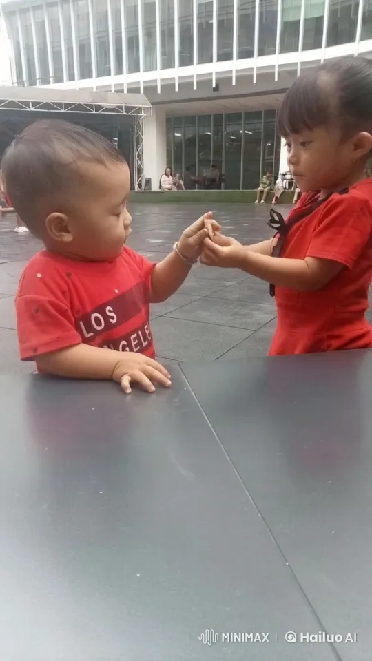 Children Playfully Imitate Kungfu in Front of Building – AI Generated Video | Hailuo AI