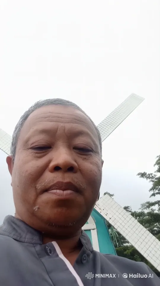 Tranquil Windmill Scene with Swaying Trees – AI Generated Video | Hailuo AI