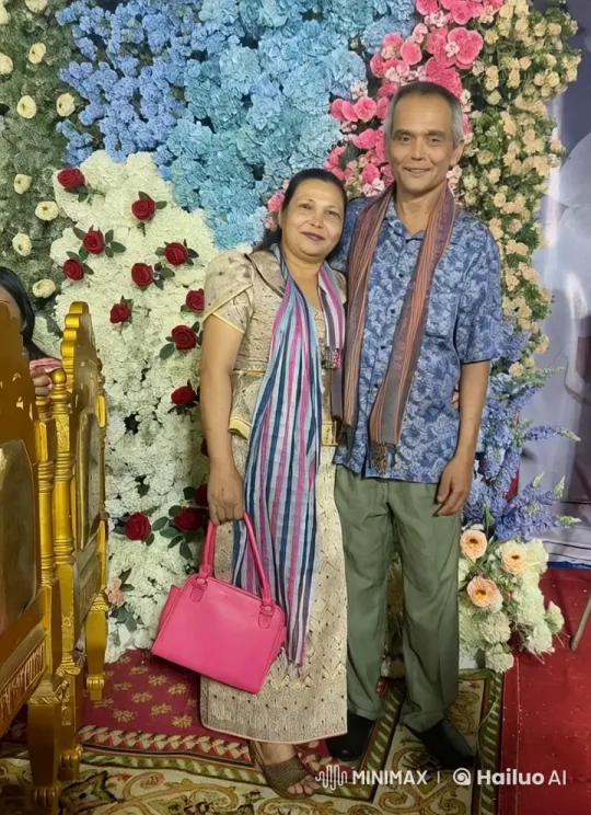 Couple Standing by Floral Backdrop with Soft Motion – AI Generated Video | Hailuo AI