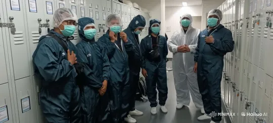 Synchronized Dance in Protective Suits at Industrial Locker Room – AI Generated Video | Hailuo AI