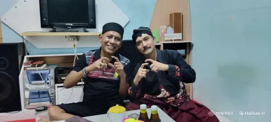 Cultural Attire, Martial Arts Discussion in Cozy Setting – AI Generated Video | Hailuo AI