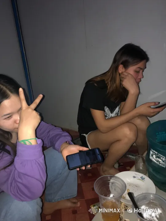 Two Women Relaxing with Smartphones Indoors – AI Generated Video | Hailuo AI