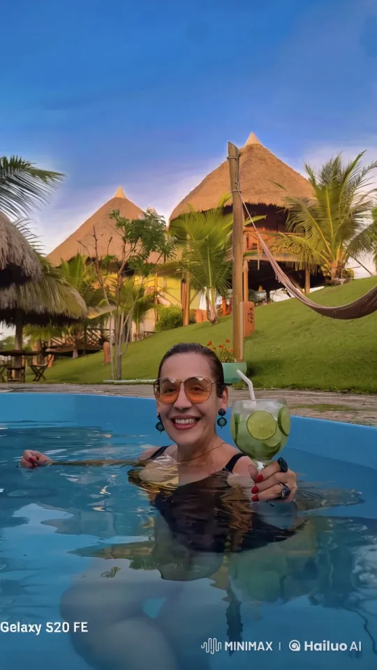 Woman Enjoying Tropical Refreshment in Serene Pool – AI Generated Video | Hailuo AI