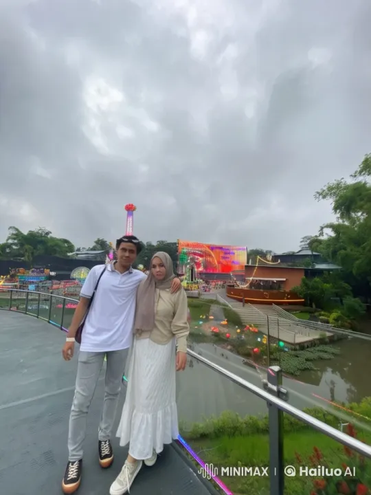 Couple's Romantic Moment at Amusement Park Bridge – AI Generated Video | Hailuo AI