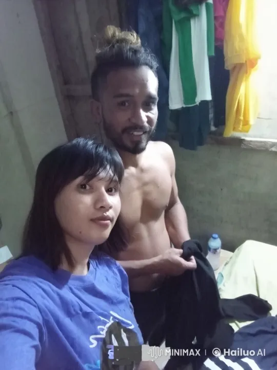 Couple Prepares for Selfie in Cozy Bedroom – AI Generated Video | Hailuo AI