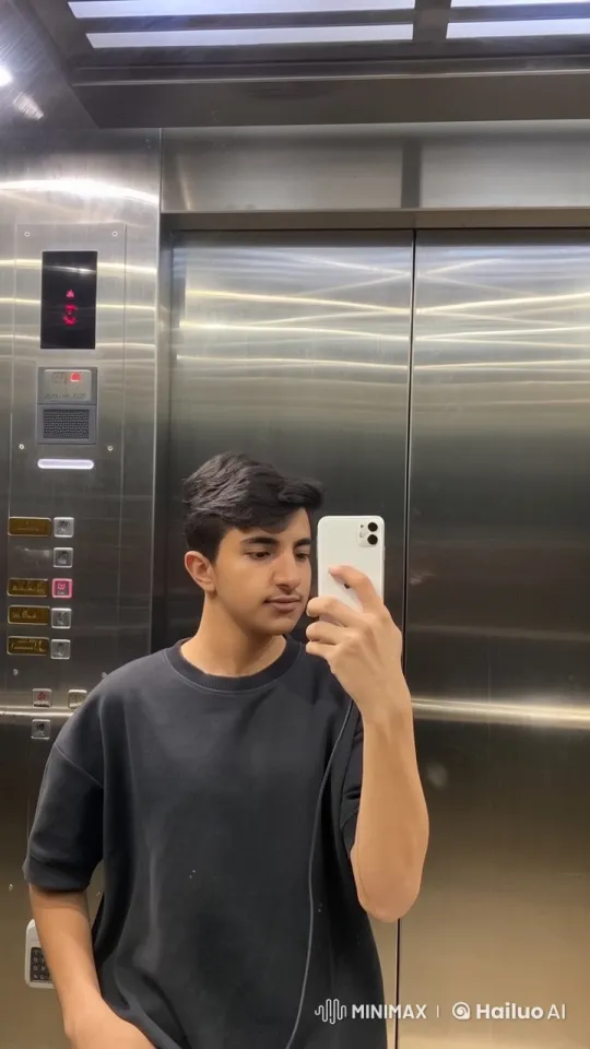 Young Man Taking Selfie in Modern Elevator – AI Generated Video | Hailuo AI