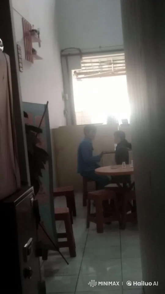 Two People Engaging in Conversation in a Dim Room – AI Generated Video | Hailuo AI