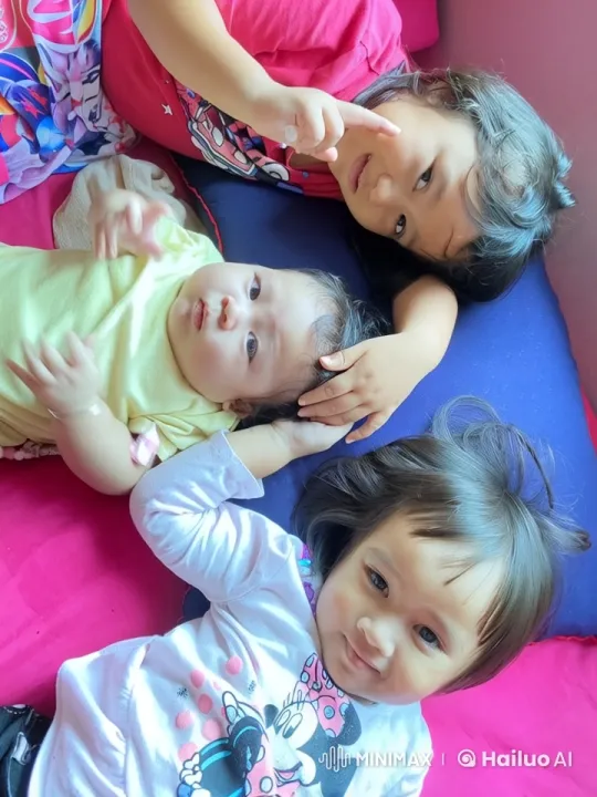 Three Children Bonding on Colorful Cushions – AI Generated Video | Hailuo AI