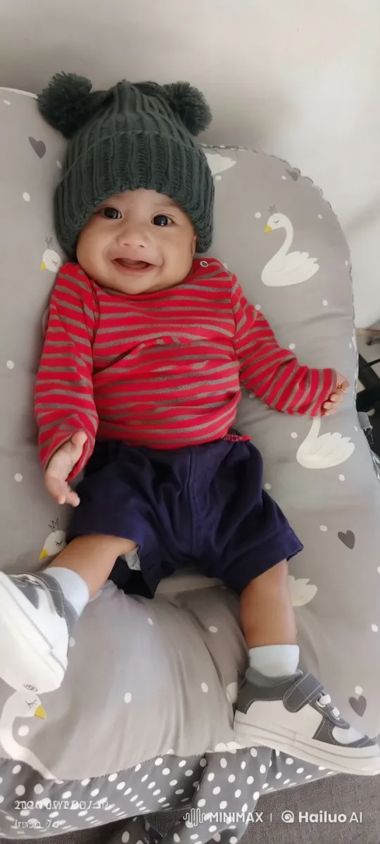 Cozy Baby Resting on Decorative Cushion – AI Generated Video | Hailuo AI