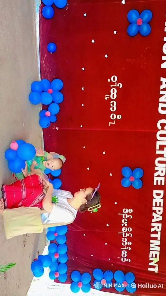 Woman and Baby Enjoy Balloons at AND CULTURE Event – AI Generated Video | Hailuo AI