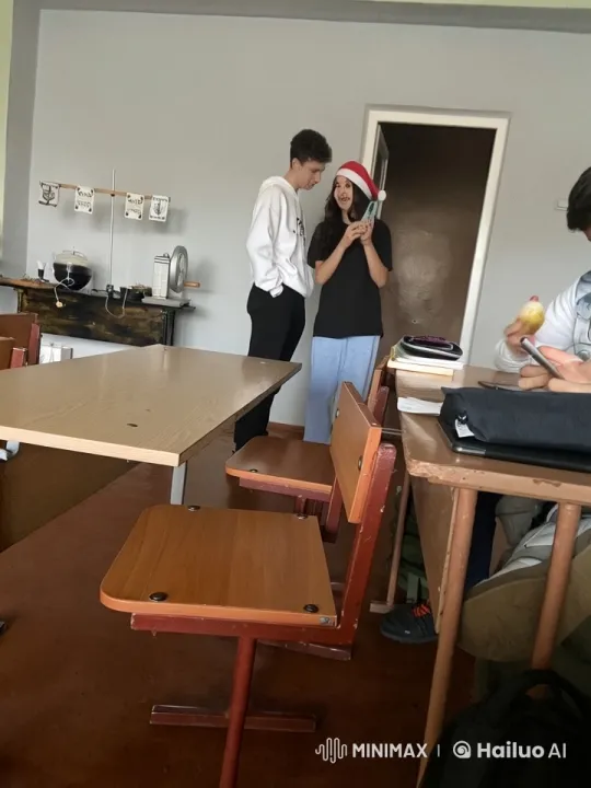 Santa Hat Girl and Boy Share a Romantic Kiss in Live2D Classroom Setting – AI Generated Video | Hailuo AI