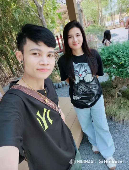 Two People Taking a Selfie in a Peaceful Park – AI Generated Video | Hailuo AI