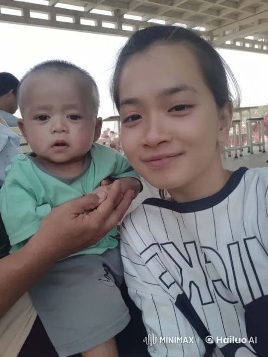 Intimate Moment: Child on Adult's Lap in Outdoor Setting – AI Generated Video | Hailuo AI