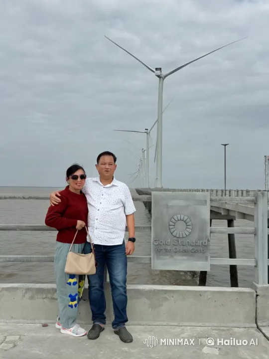 Couple Performs Martial Arts in Front of Wind Turbines – AI Generated Video | Hailuo AI