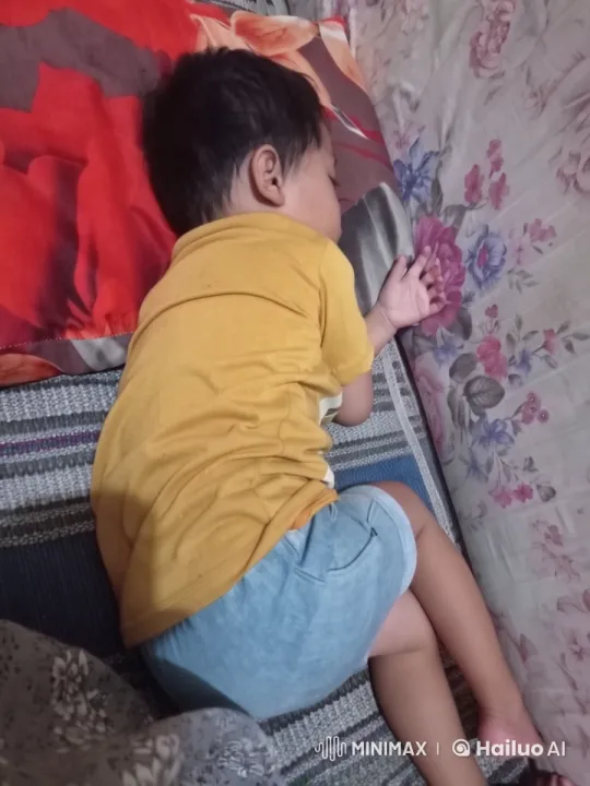 Sleeping Child on Floral Sheets - Peaceful Rest – AI Generated Video | Hailuo AI