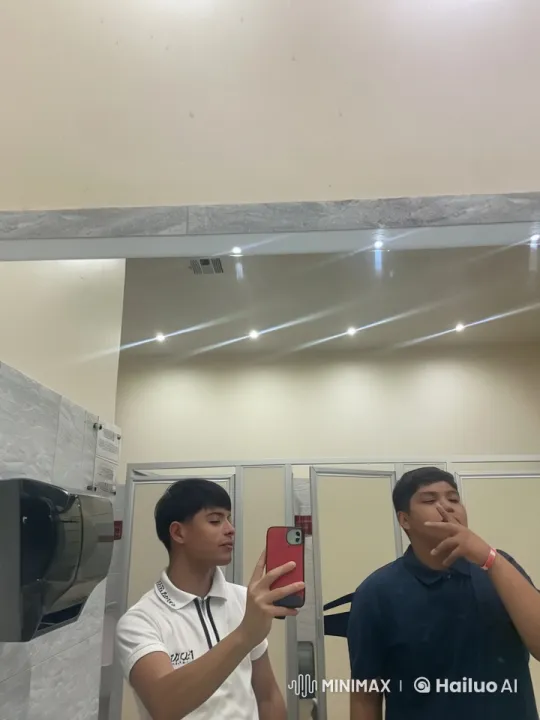 Two Young Men Share Affectionate Moment in Restroom – AI Generated Video | Hailuo AI