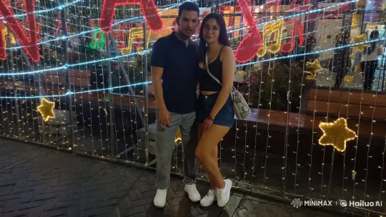 Dancing Couple in Festive Lights Display – AI Generated Video | Hailuo AI