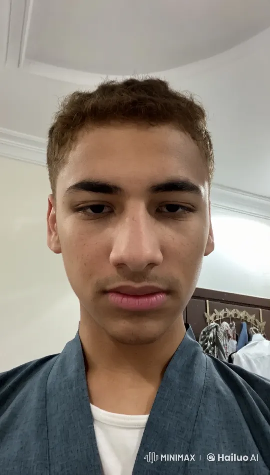 Young Man Smoking in a Dimly Lit Room – AI Generated Video | Hailuo AI