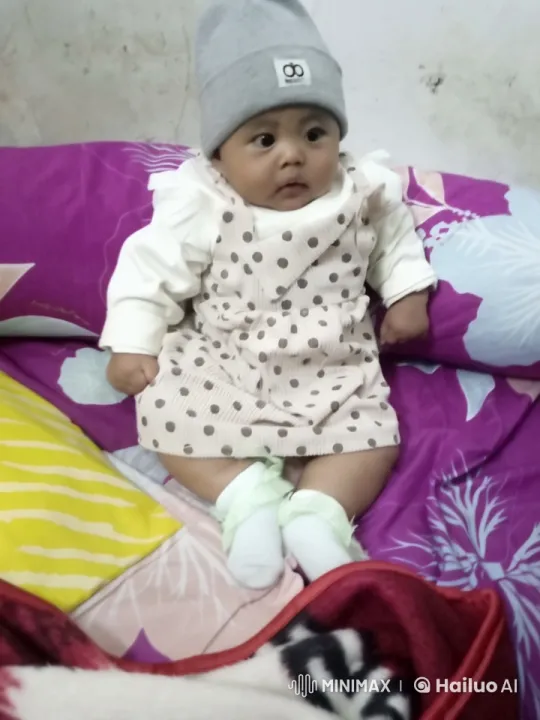 Cozy Baby in Polka-Dotted Outfit on Colorful Bed – AI Generated Video | Hailuo AI