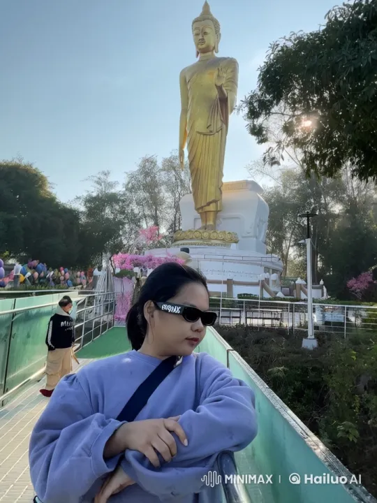 Peaceful Garden with Golden Buddha and Leaning Woman – AI Generated Video | Hailuo AI
